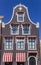 Front facade of a historic house with clock gable in Harlingen