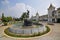 Front Facade of Yangon Central Railway Station with round pond fountain decorated with statues