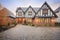 front gable tudor, cobblestone driveway