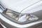 Front headlight view of a Japanese-made car Toyota Carina 2000 year release in gray. Toyota car catalog