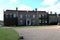 Front of Hinton Ampner with gravel drive