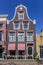 Front of a historic house with clock gable in Harlingen