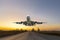 Front image commercial passenger aircraft or cargo transportation airplane fly up taking off from airport runway motion blur