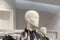 Front image of shiny white female mannequin doll with a male mannequin figure in the back, front image of a display dummy figures