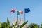 In front of Milan Cathedral the Italian, English and European flags are flying