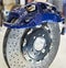 Front monoblock caliper and front brake disc