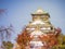 front of osaka castle with blue sky and red leaves of ginkgo tree at front palace at osaka japan autumn season travel