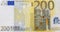 Front part of 200 euro banknote close-up with small details. European currency.