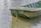 Front part of small fishing green boat