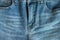 front part woman`s jeans pants with fly blue color close up. concept of female and women`s health and problems of the pelvic flo