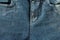 front part woman`s jeans pants with fly blue color close up. concept of female and women`s health and problems of the pelvic flo