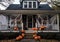 Front porch of a bungalow house has been decorated with spiders Halloween