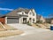 Front porch entrance of newly built 2-story house with attached