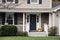 Front porch of resedential home with autumn decorations