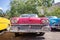 Front of of a red classic american Oldsmobile car