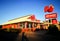 The front of Red Rooster is an Australian fast food restaurant chain founded in 1972 that specialises in roast chicken.