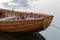 Front of a rowboat in calm water in the harbour