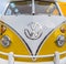 Front of a shiny classic yellow Volkswagen