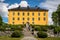 Front summer view of the old historic beautiful yellow orange Wenngarn Castle in Sigtuna Sweden.