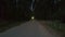 Front takeoff view from drone car with headlights riding on night road