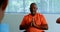 Front view of active African American senior man performing yoga in fitness studio 4k