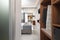 Front view of apartment entrance hallway with wooden wardrobe cabinet. Modern bedroom hotel interior room and old city street view