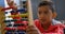 Front view of Asian schoolboy solving math problem with abacus at desk in a classroom at school 4k