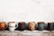 Front view assorted coffee cups on a wooden table background with copy space