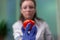 Front view of biologist reseacher woman analyzing tomato injected with chemical dna