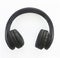 Front view of black wireless headphones on white background. Rotating, compact and lightweight headphones for easy portability