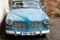 Front view of blue vintage Volvo Amazon 1966 car parked in the street of alsatian village