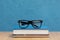 Front view books with glasses. High quality and resolution beautiful photo concept