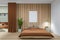 Front view on brown bedroom interior with empty white poster