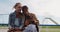 Front view of a Caucasian and a mixed race girl taking selfie on a merry-go-round