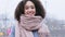 Front view close-up female satisfied smiling face. Portrait outdoors African American woman girl with curly hair smiling