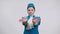 Front view of concentrated Caucasian girl showing emergency exits gestures and smiling posing in stewardess uniform at