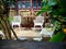 Front View Empty Chair With Plant in Pot on Balcony, Wooden Window Frame,