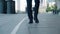 Front view feet of businessman commuting to work. Confident man entrepreneur in leather shoes and formal suit walks