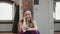 Front view of female dance teacher sitting on floor in studio