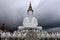 Front view of five sitting white Buddhas and a cloudy sky at Pha Sorn Kaew, in Khao Kor, Phetchabun, Thailand.