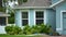 Front view of generic private house in southern Florida. Single family home with double car garage door and wide