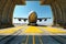 Front view from the ground of a cargo plane at the airport. Loaded transport aircraft is taxing from the cargo terminal