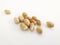Front view of group of peeled natural peanuts on white background. Organic dried fruits for a healthy diet and ideal for peanut