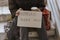 front view homeless man holding help sign plastic bag. High quality photo
