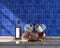 Front view kitchen with marble kitchen countertop coffee mugs and copper hammered cups on it under warm morning sunshine, blue