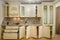 Front view of luxury modern neoclassic beige kitchen interior