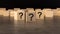 front view on many wood cubes with question marks. many question arising concept