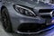 Front view of a Mercedes Benz C 63s AMG coupe 2017. Front Headlight. Dark Matt colour .Car exterior details.