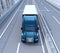 Front view of metallic blue Fuel Cell Powered American Truck driving on highway
