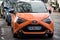 Front view of Orange Toyota Yaris parked in the street